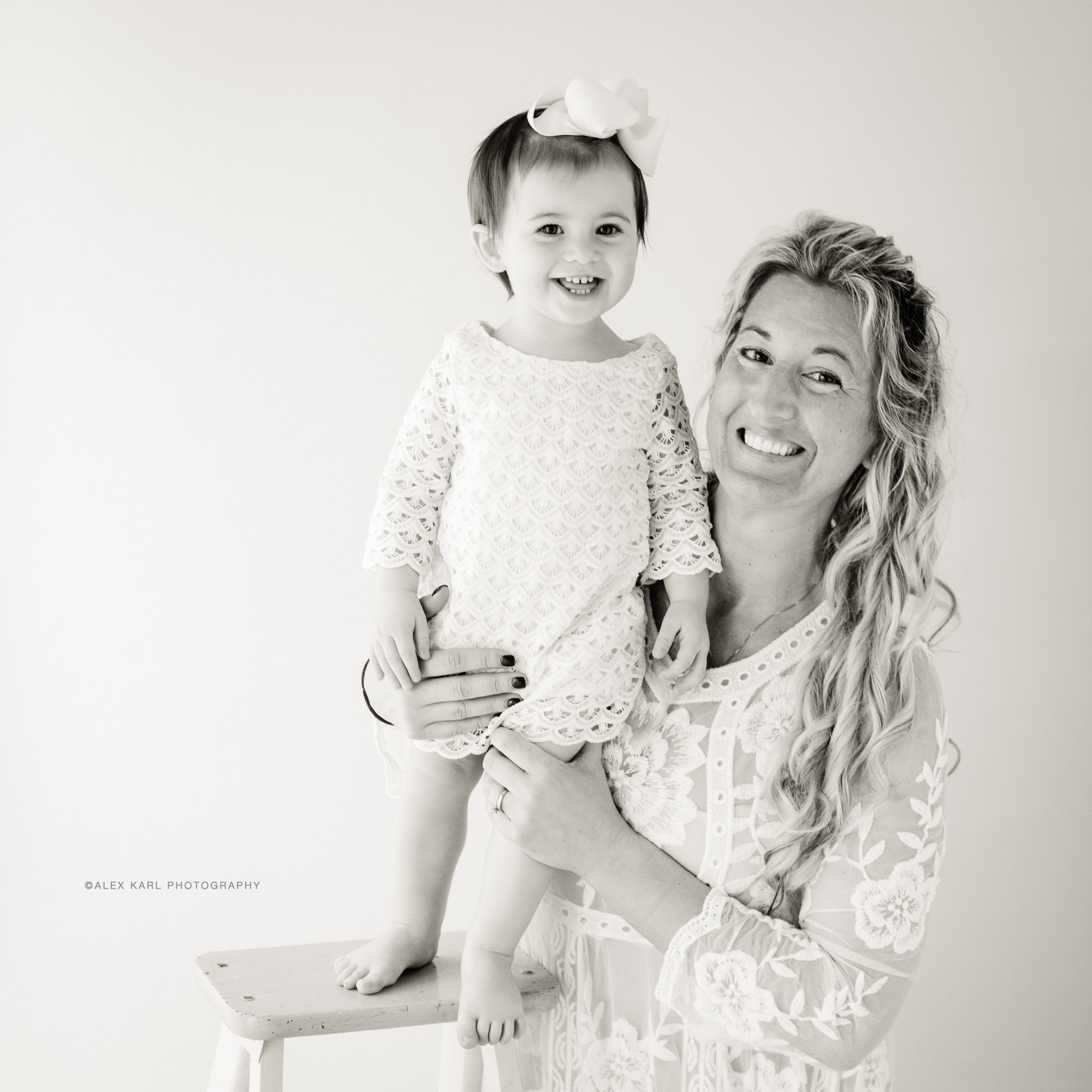 A mother stands with her baby | Alex Karl Photography | Palm Beach Family Photographer