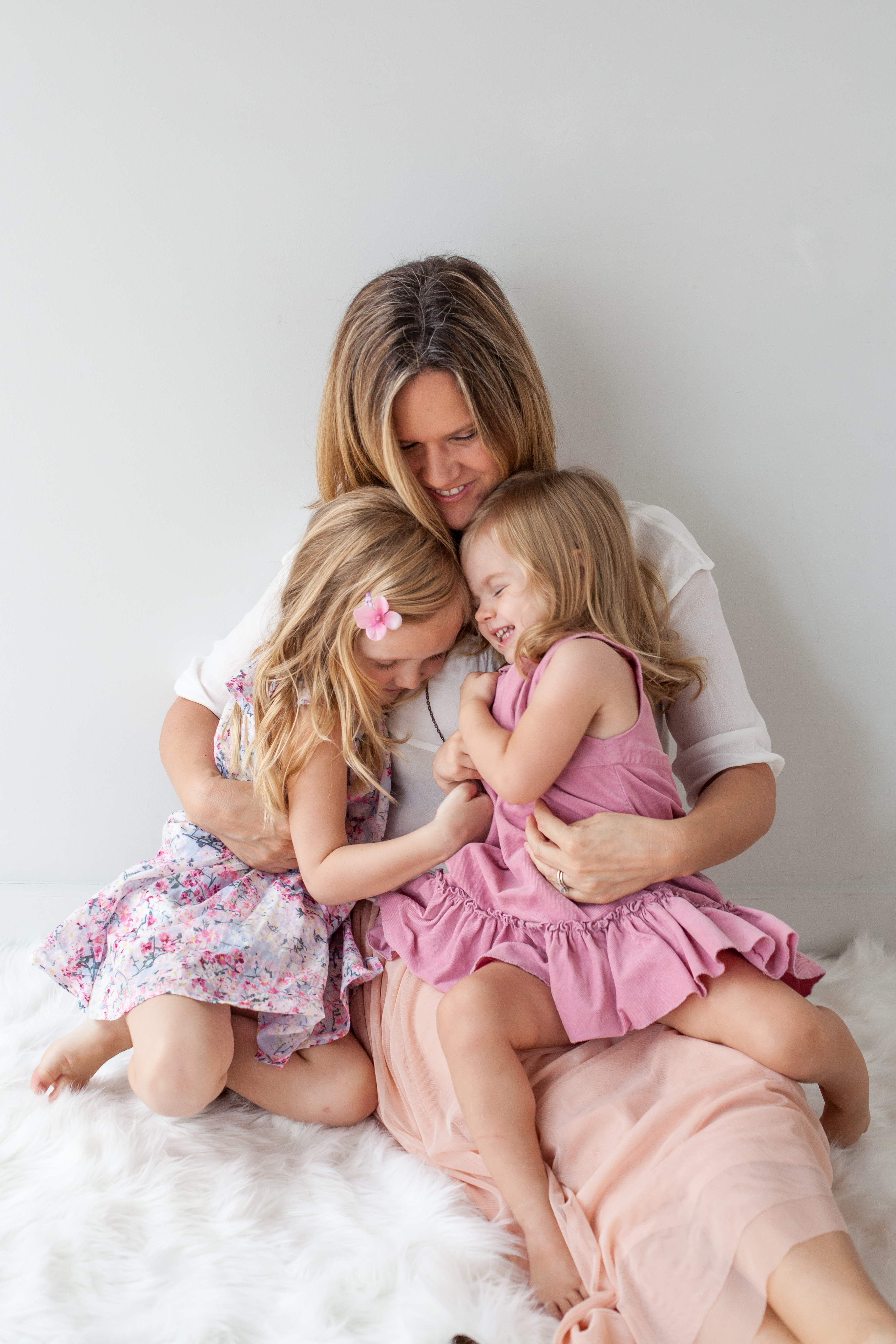 Girls snuggle their mother  | Alex Karl Photography | Palm Beach Family Photographer