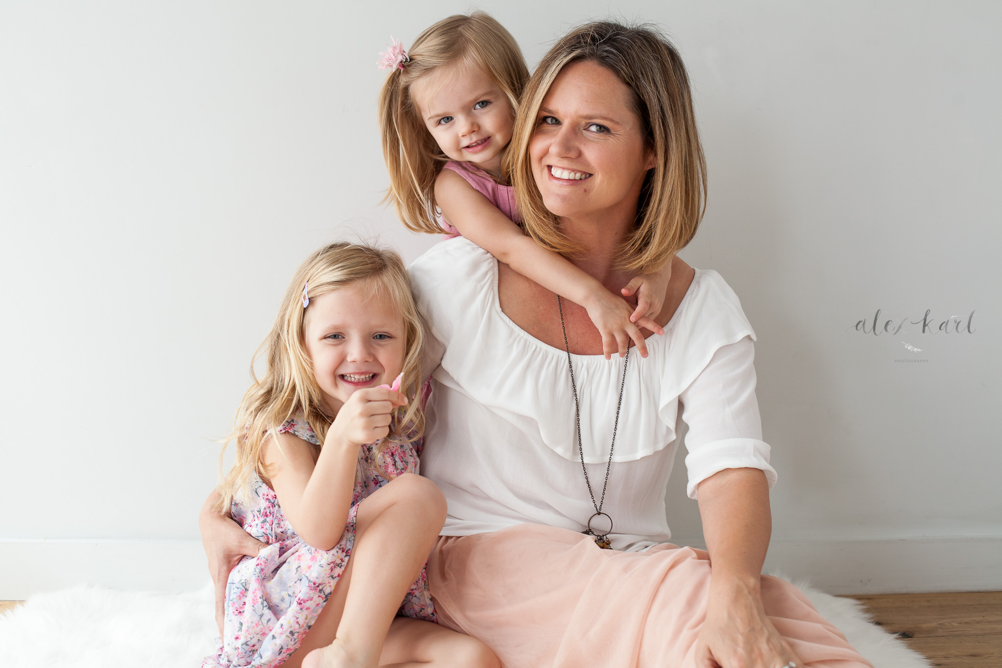 A mother sits with her girls  | Alex Karl Photography | Palm Beach Family Photographer