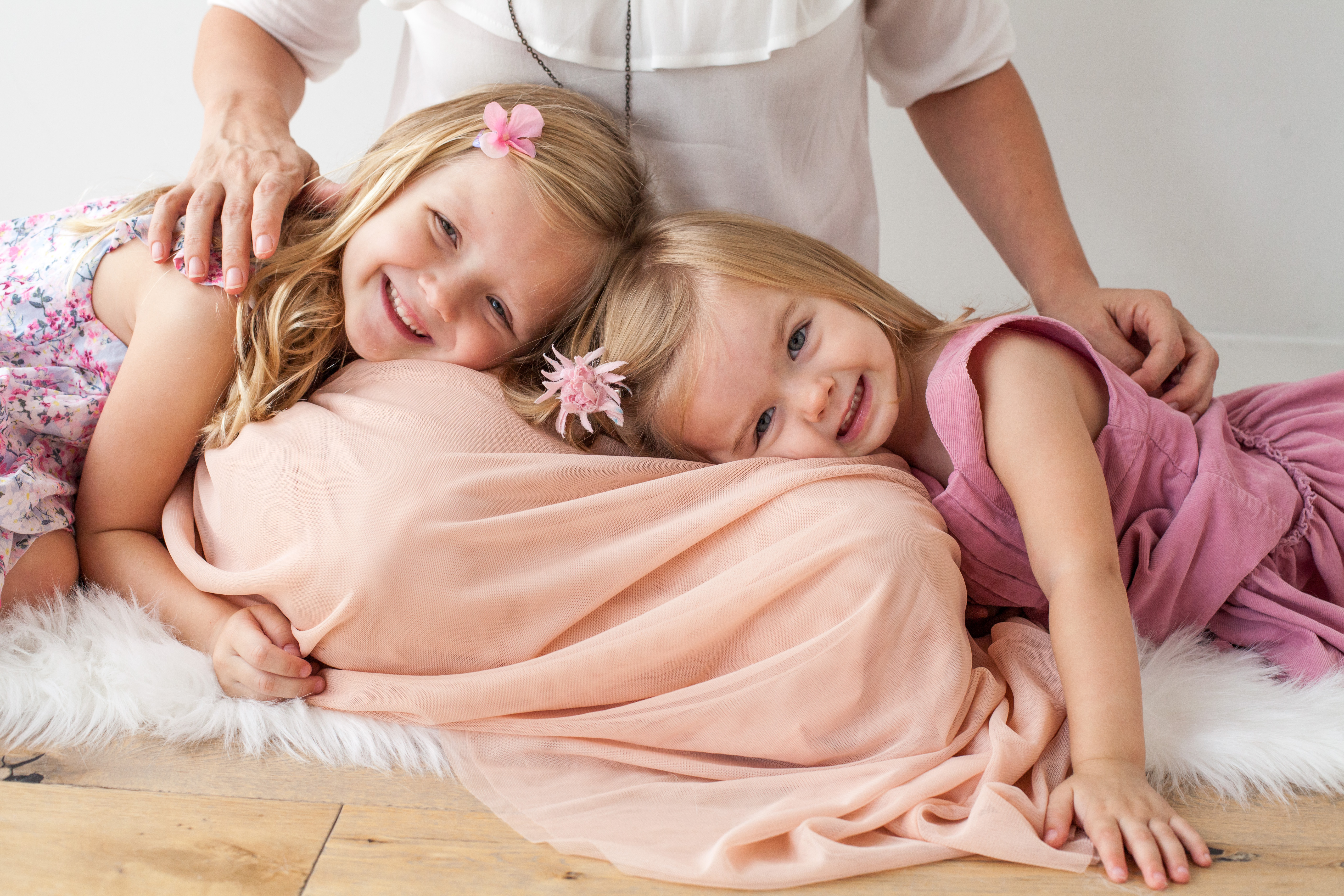 Girls lay on their mother's lap  | Alex Karl Photography | Palm Beach Family Photographer