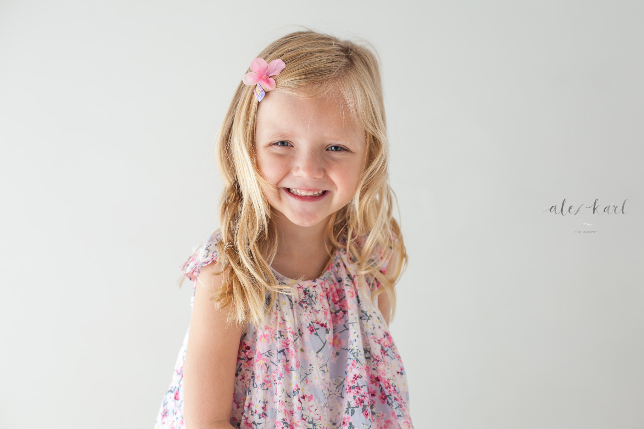 A girl smiles sweetly  | Alex Karl Photography | Palm Beach Family Photographer
