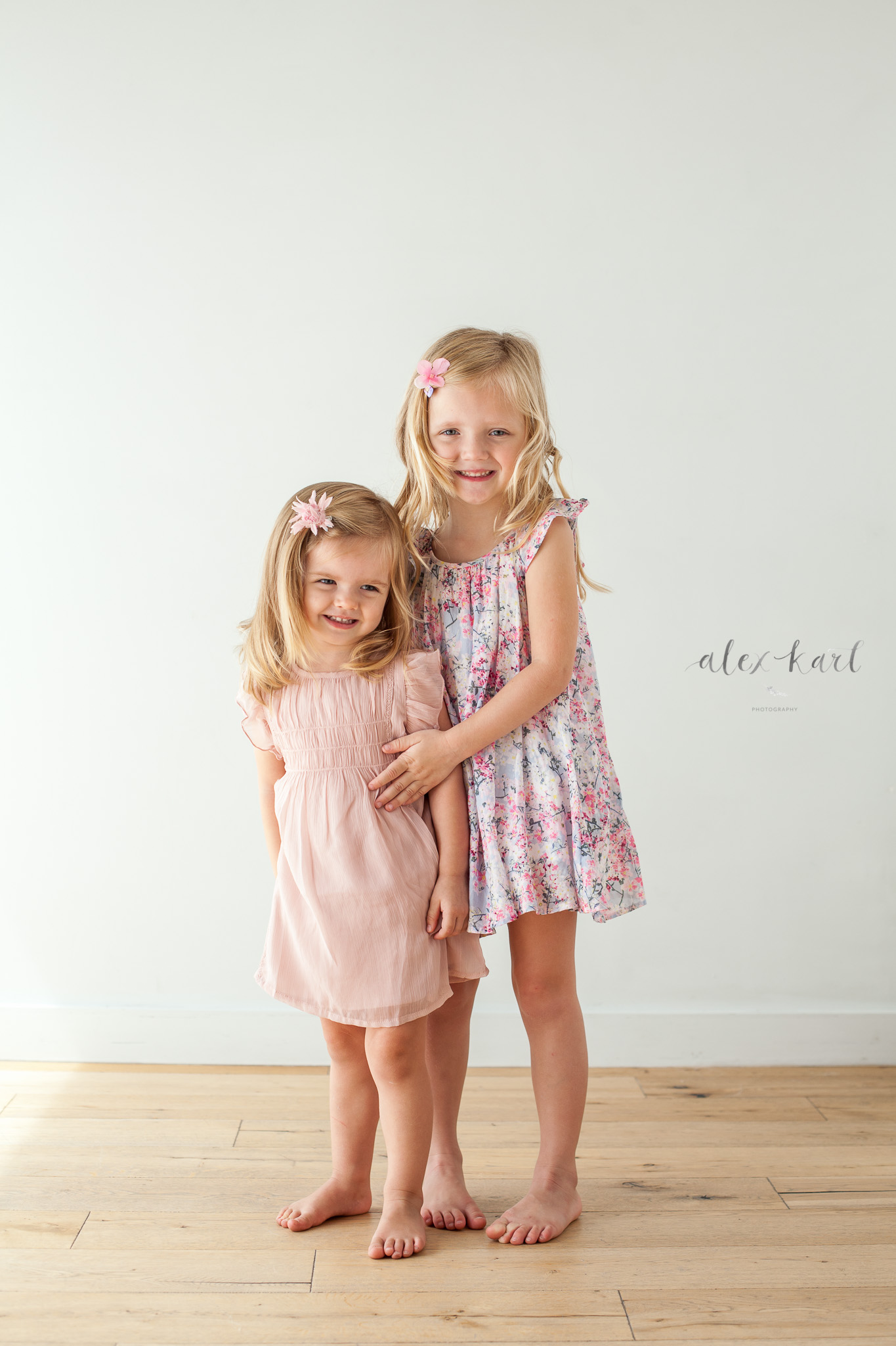 Sisters hold each other  | Alex Karl Photography | Palm Beach Family Photographer