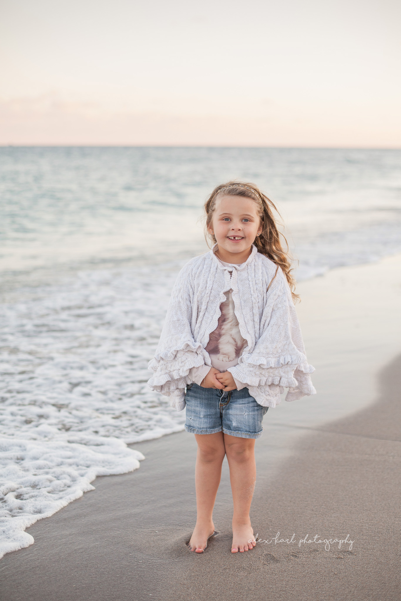 A girl stands near the shore | Alex Karl Photography | Palm Beach Family Photographer