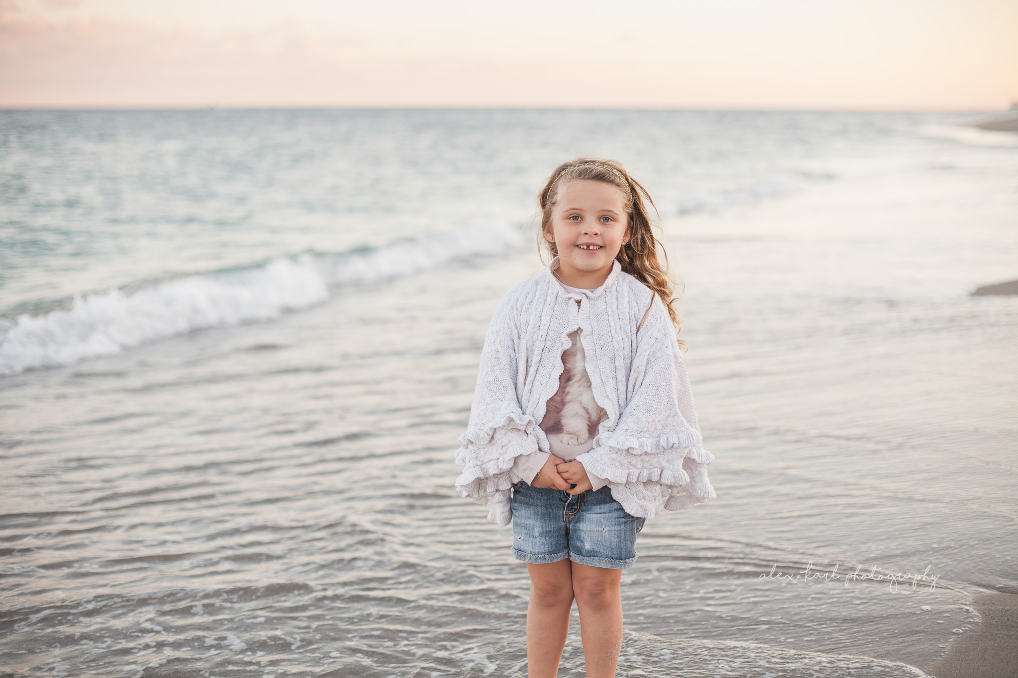 A girl stands in the ocean | Alex Karl Photography | Palm Beach Family Photographer