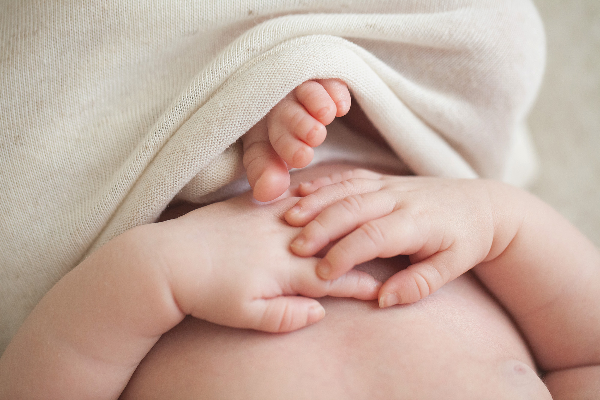 A baby's toes touch his hands | Alex Karl Photography | Palm Beach Newborn Photographer