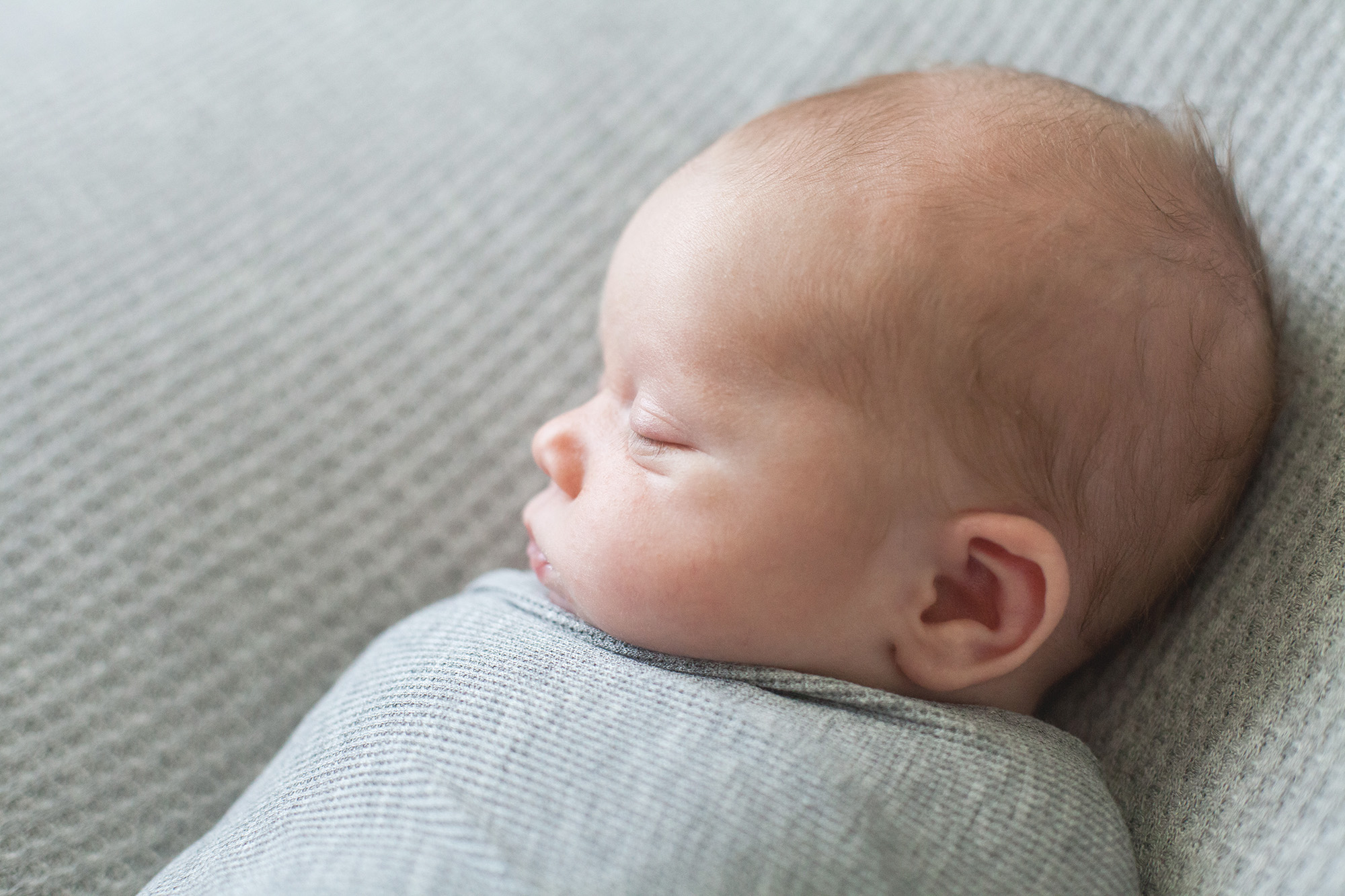 A baby sleeps swaddled | Alex Karl Photography | Palm Beach Newborn Photographer