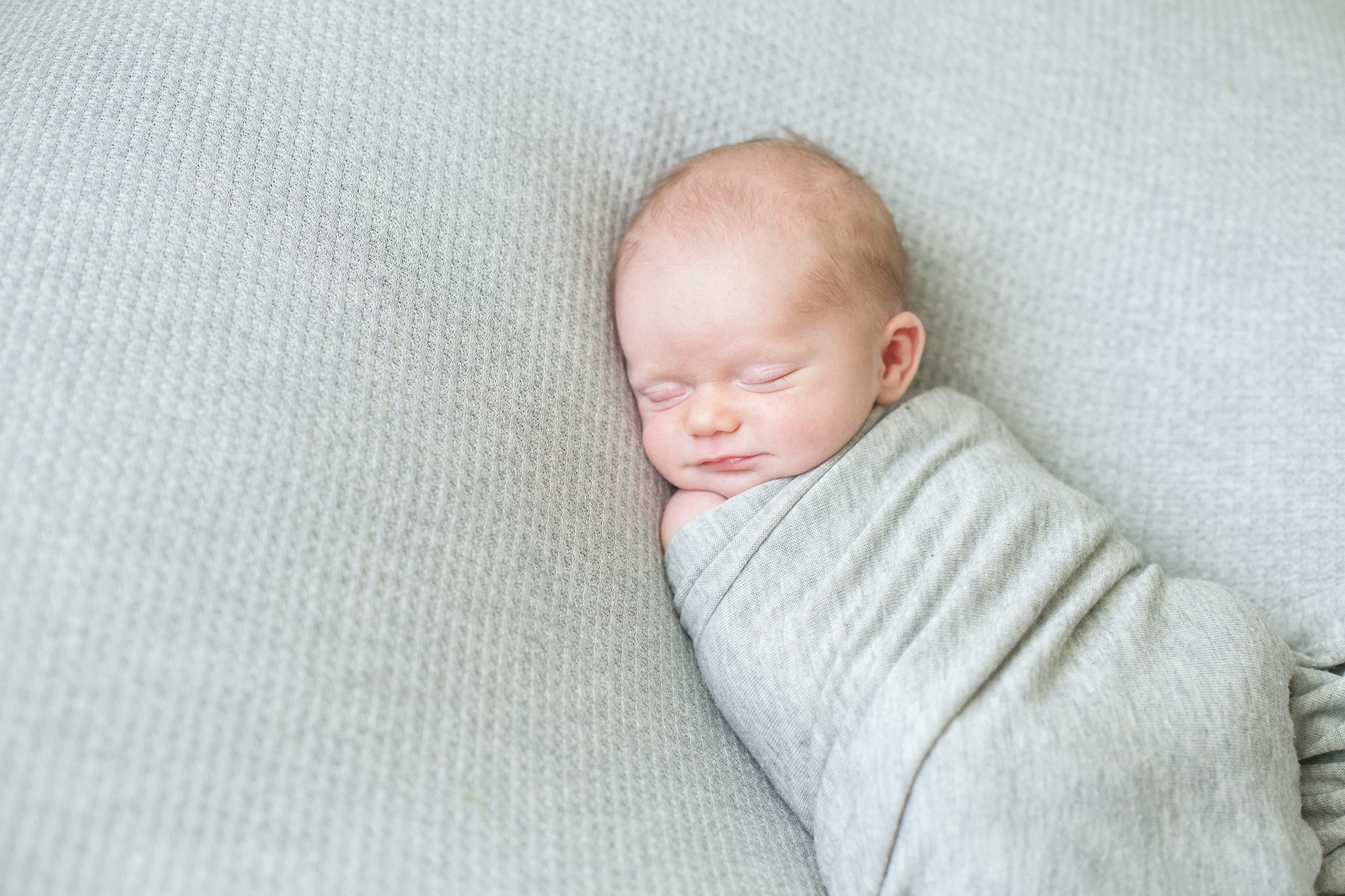 A baby smiles in his sleep | Alex Karl Photography | Palm Beach Newborn Photographer