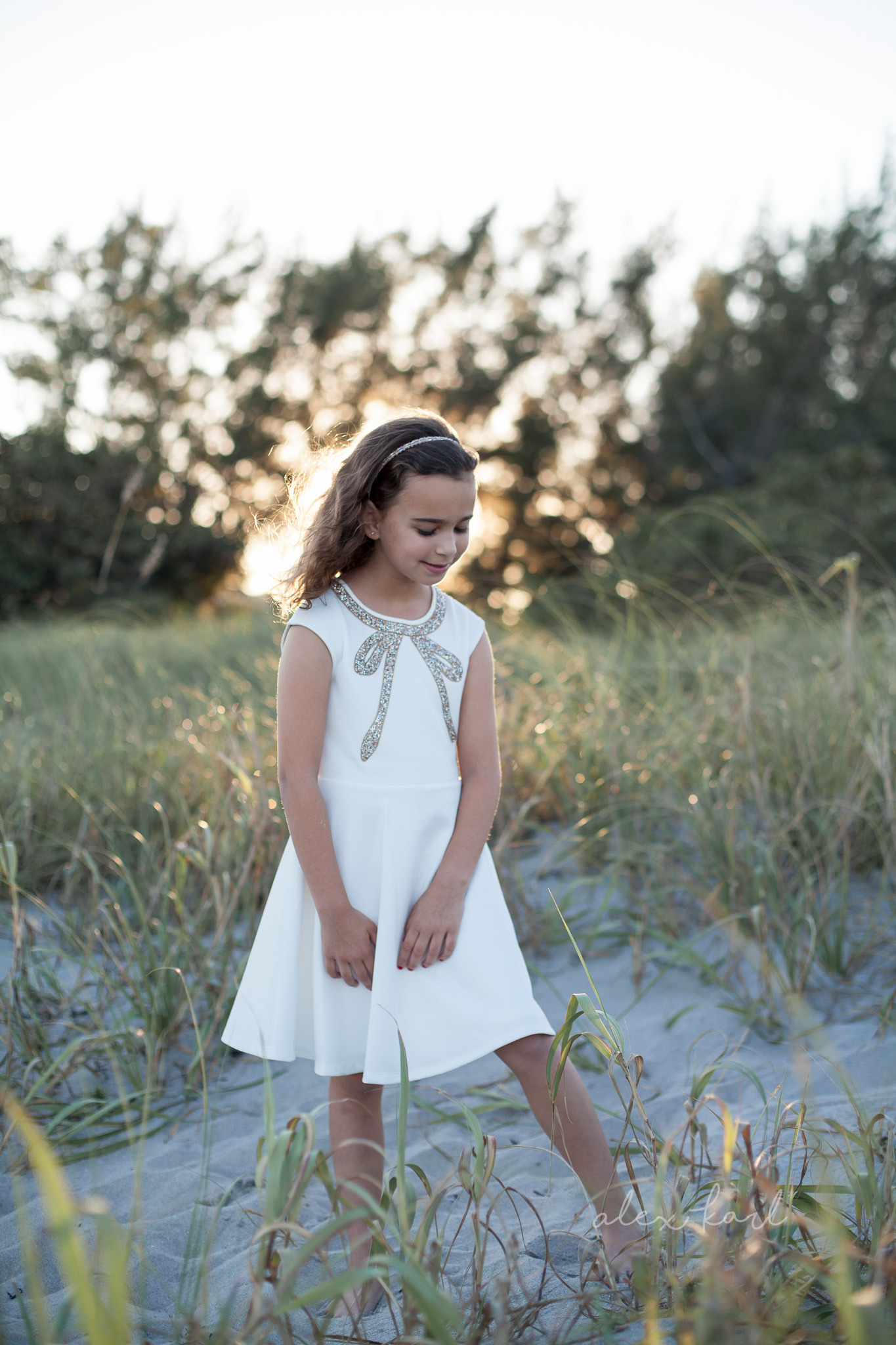 A girl looks down | Alex Karl Photography | Palm Beach Family Photographer