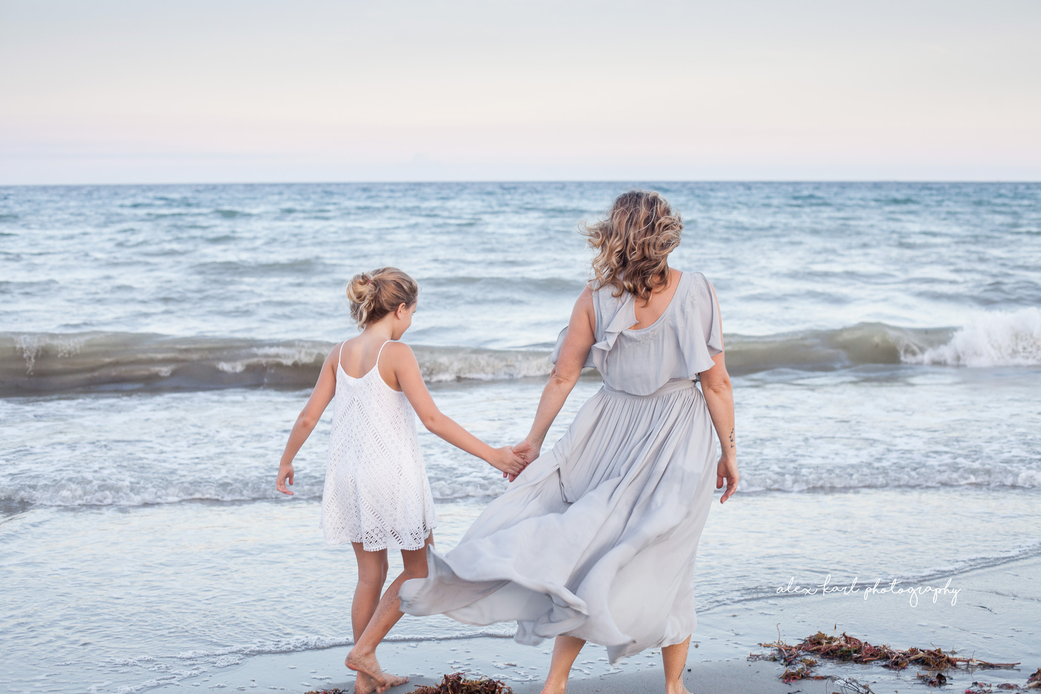 A mother and daughter walk along the beach  | Alex Karl Photography | Palm Beach Family Photographer