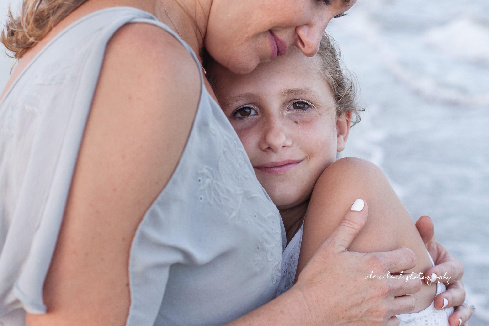 A girl rests in her mother's arms  | Alex Karl Photography | Palm Beach Family Photographer