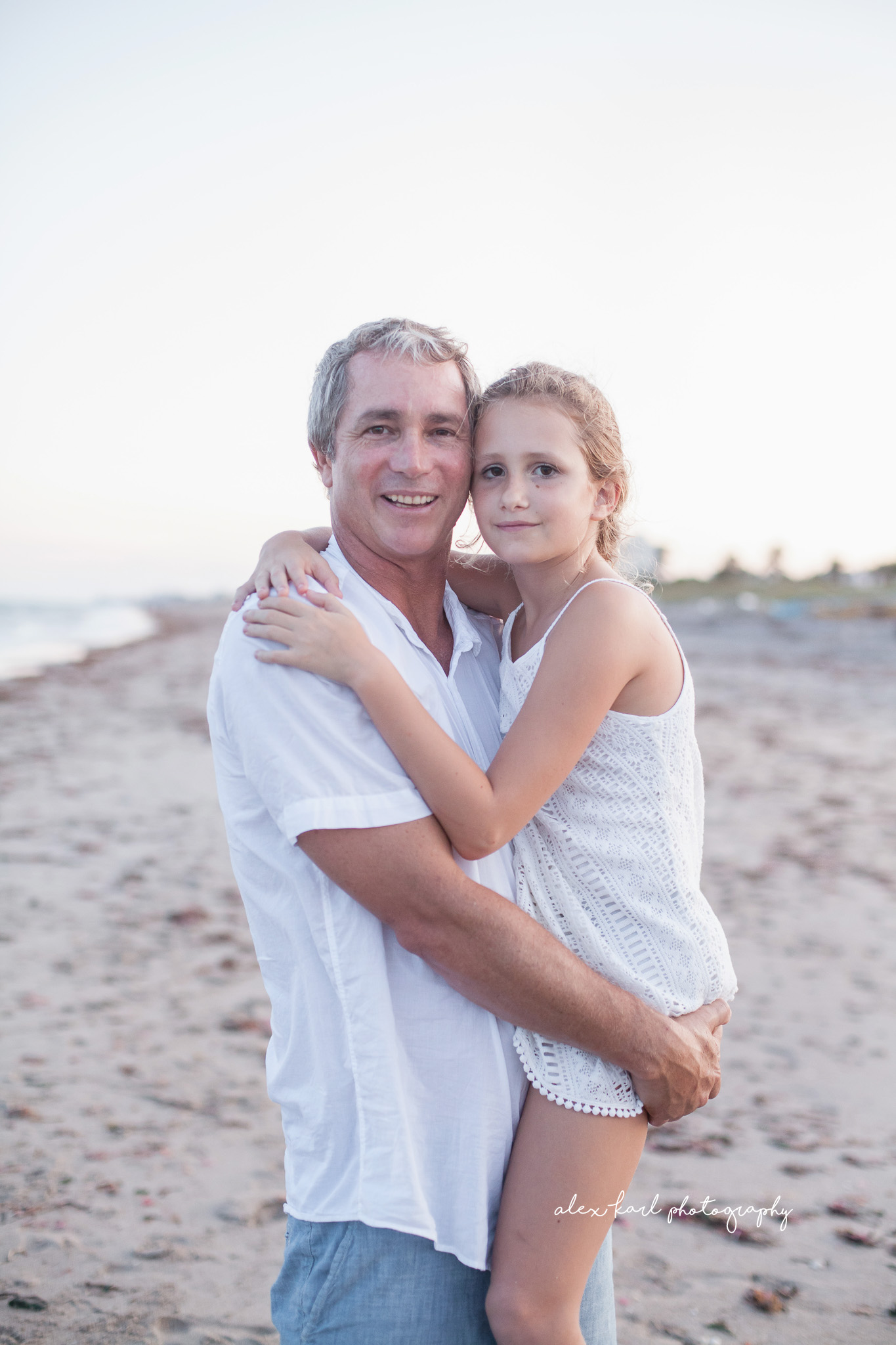 A father holds his daughter  | Alex Karl Photography | Palm Beach Family Photographer
