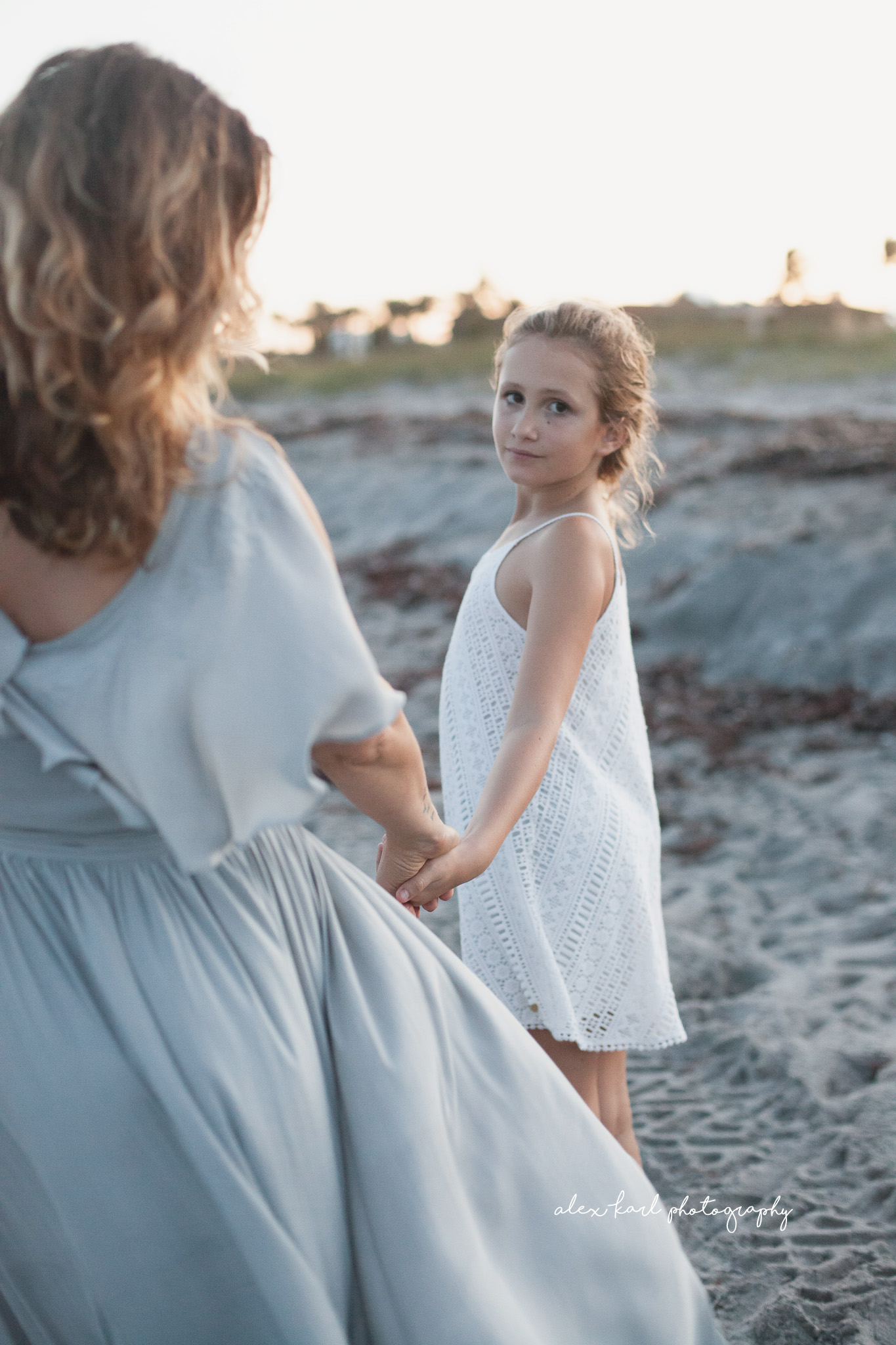 A girl looks over her shoulder  | Alex Karl Photography | Palm Beach Family Photographer
